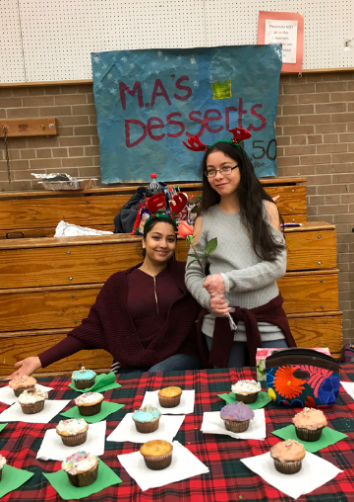 girls selling cupcakes